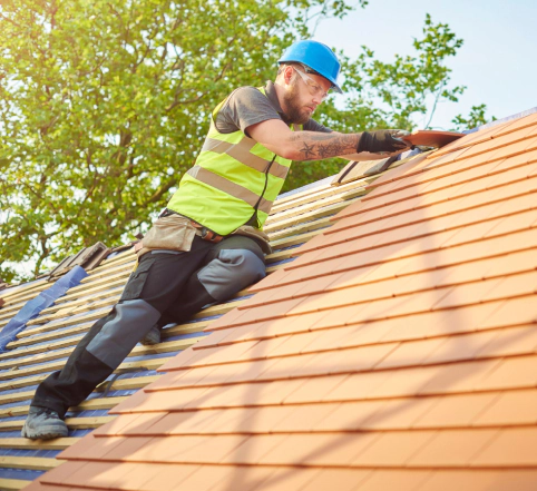 roofer nails on the roof tiles